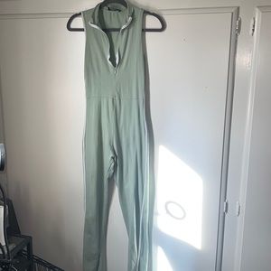 Pastel green jump suit with rimmed white lines